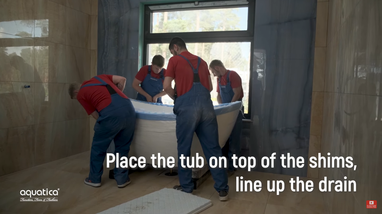 place the tub on top of the shims (web)